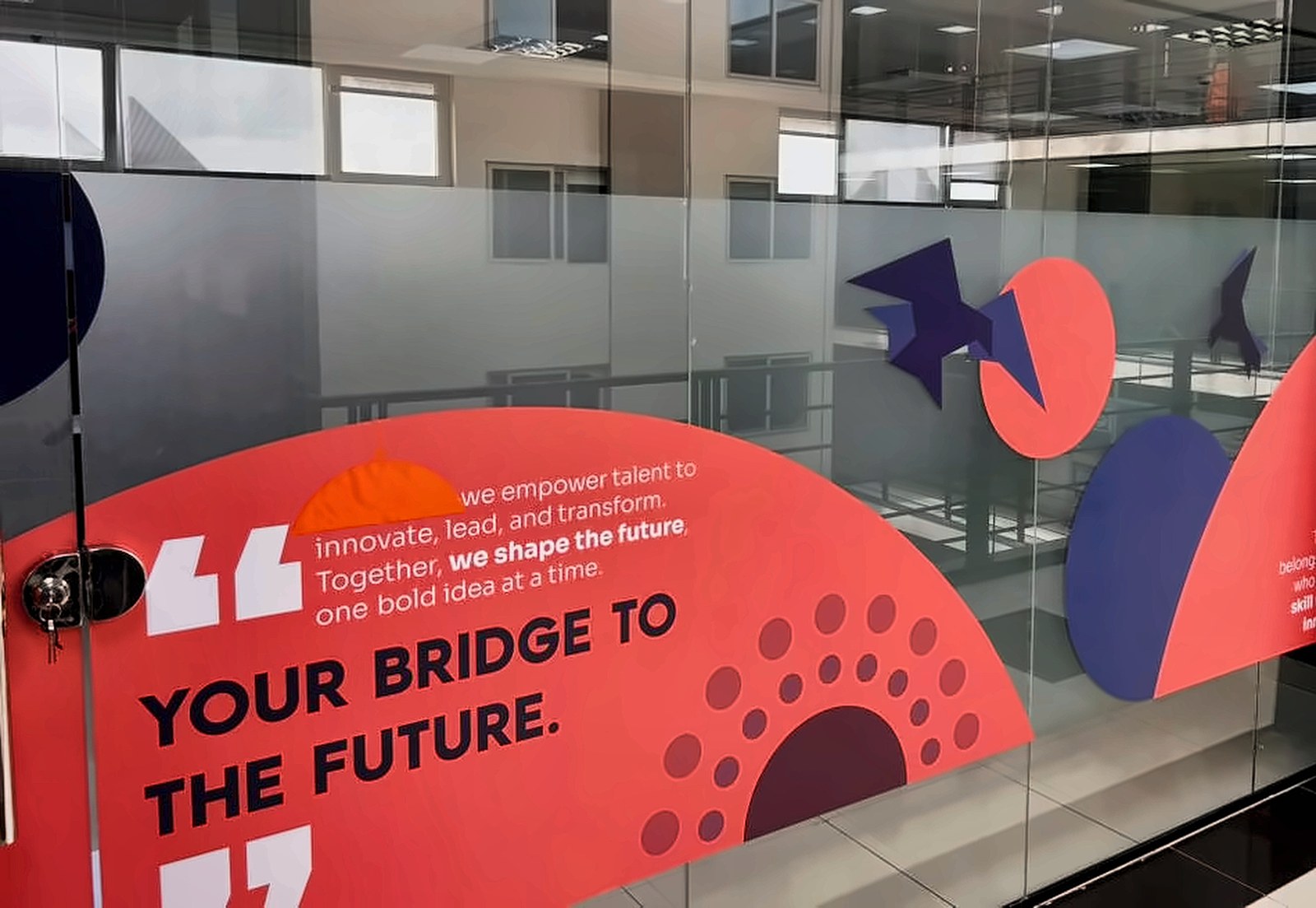MMCY training room glass graphic installed